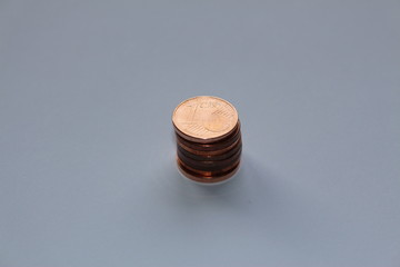 Piled up one cents on a white background
