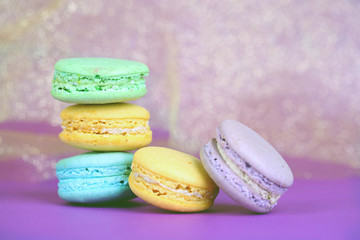 Macaroons on bright violet background