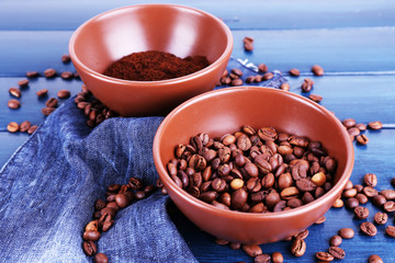 Two bowls of ground coffee and coffee beans