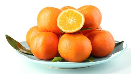 Tasty mandarins on plate isolated on white