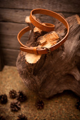 brown leather belt for women on wooden background