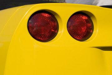 Yellow Car with Red Lights