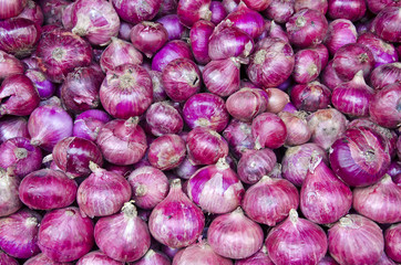 red onion vegetable background in market