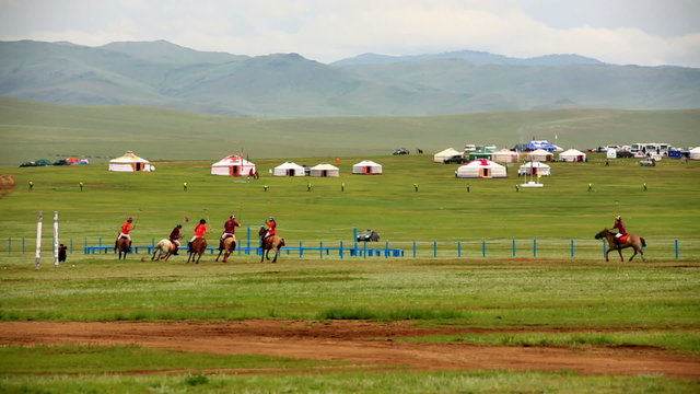 Men playing polo during Naadam Festival
