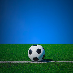 Naklejka premium soccer ball on soccer field