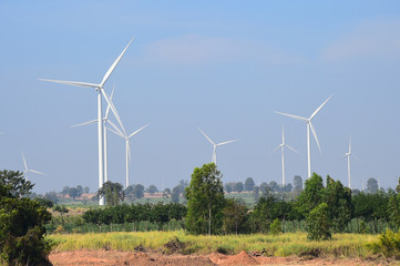 wind turbine against cloudy blue sky background