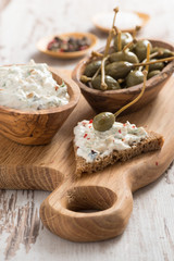 toast with cheese pate and capers
