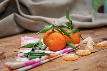 Ripe sweet tangerine with leaves