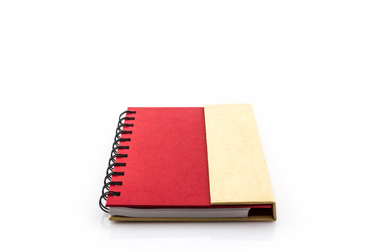 Red diary book on white background.
