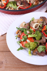 Braised wild mushrooms with vegetables and spices in pan and
