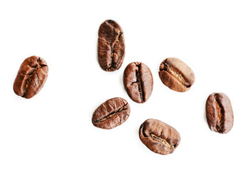 Coffee beans on white table, close-up