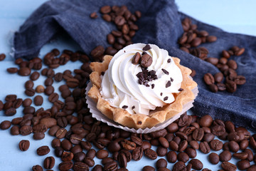 Cake with cream and spilled coffee beans