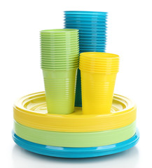 Bright plastic disposable tableware isolated on white