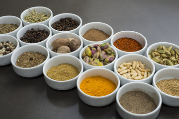 large collection of different spices and herbs isolated on Black