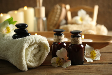 Composition of spa treatment, candles in bowl with water