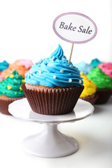 Delicious cupcakes with inscription close-up