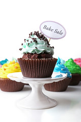 Delicious cupcakes with inscription close-up