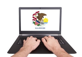 Hands working on laptop, Illinois