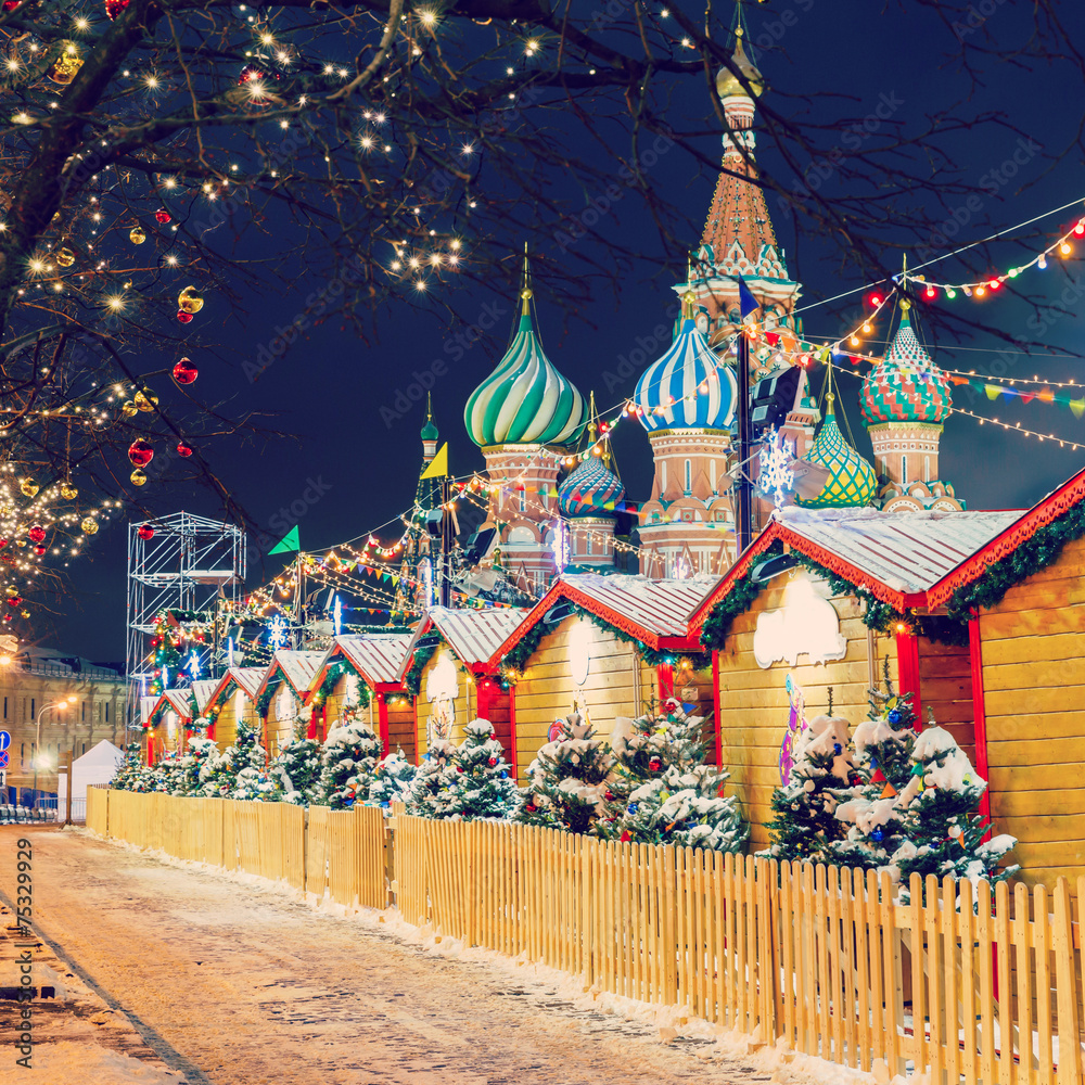 Wall mural Christmas balls on tree branches in Red square