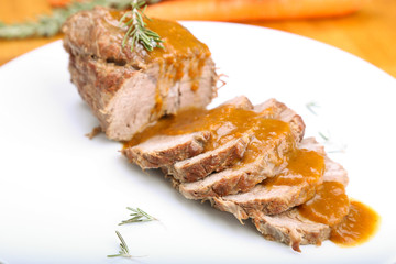 Slices of veal roll with sauce