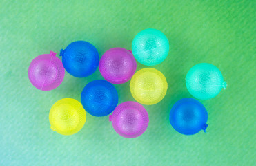 Group of plastic ice cubes on colorful background