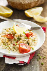 Warm quinoa salad with chickpeas and tomatoes