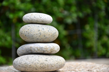Fototapeta na wymiar Stack of zen rocks in garden
