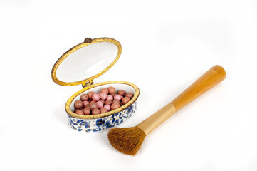 make-up brush with powder balls isolated on white