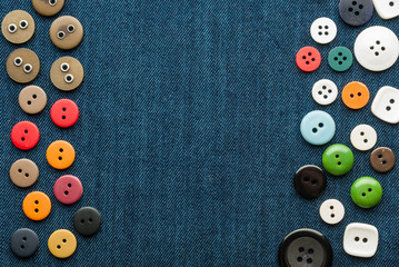 Closeup blue jeans background with buttons.