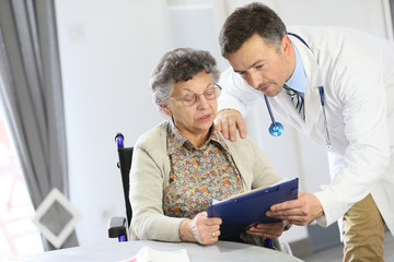 Fototapeta premium Doctor with elderly woman in nursing home