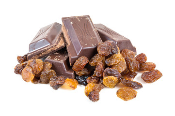 Chocolate pieces and raisins on white background