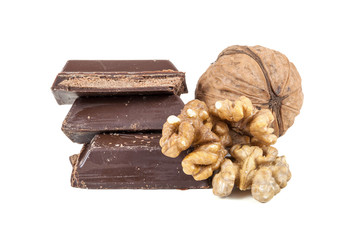 Chocolate pieces and walnuts on white background