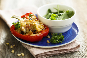 Stuffed bell pepper with nuts and salad