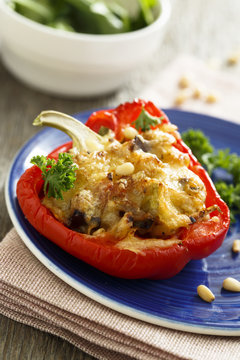 Stuffed bell pepper with nuts and salad