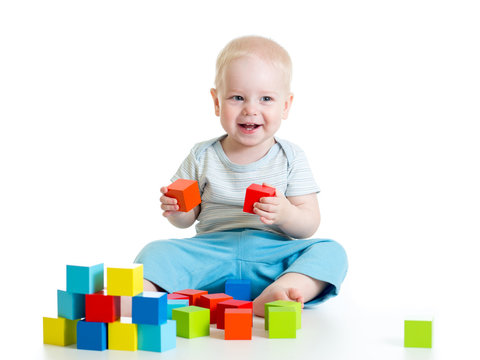 child boy playing wooden toys