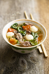 Asian soup with rice dumplings