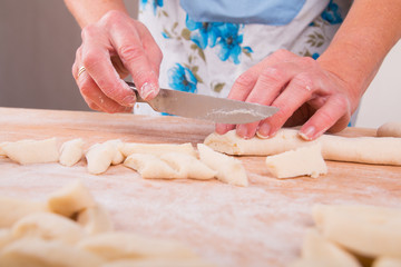 Making noodles on board from dough
