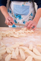 Making noodles on board from dough