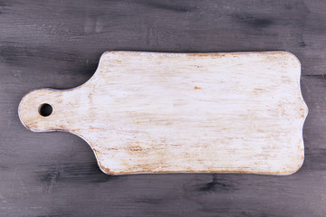 Empty cutting board on wooden background