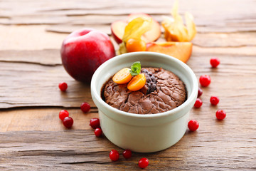 Hot chocolate pudding with fondant centre on table, close-up