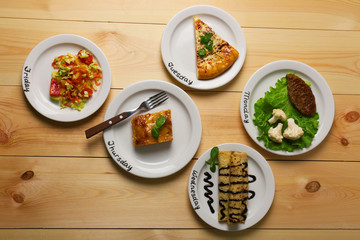 Daily menu. Plates with food on table