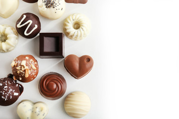 Delicious chocolate candies isolated on white