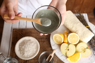 Beautician makes cosmetic facial masks, close-up,