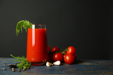 Glass of tasty tomato juice and fresh tomatoes