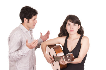 Beautiful frustrated female guitar student and teacher