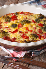 casserole with broccoli, pepper, tomatoes and bacon vertical