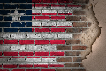 Dark brick wall with plaster - Liberia