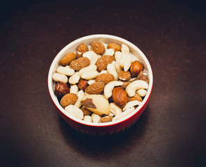 mixed nuts in red bowl