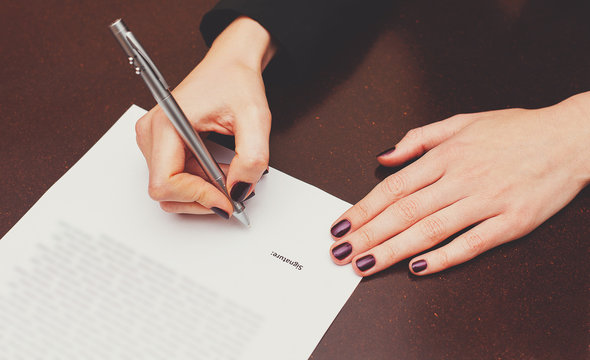 Business worker signing the contract