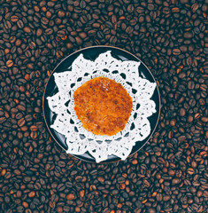 Cookie on vintage  plate with coffee background